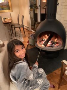 Toasting marshmallows in the wood stove